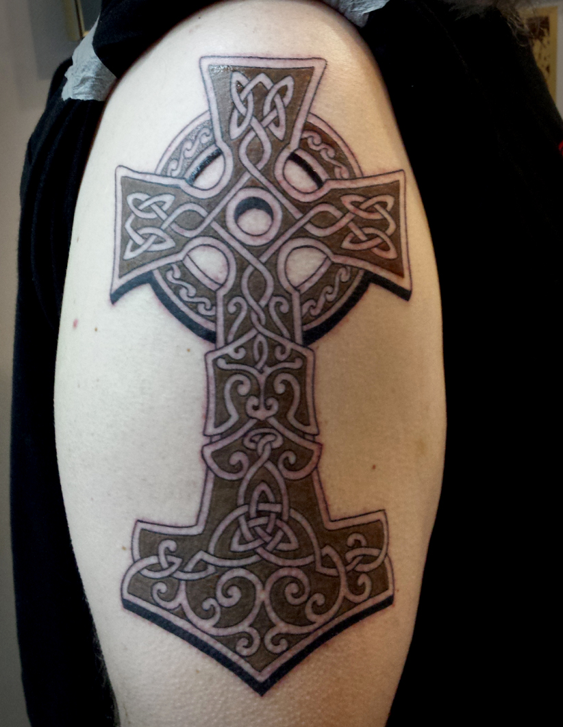 Arm tattoo of cross
