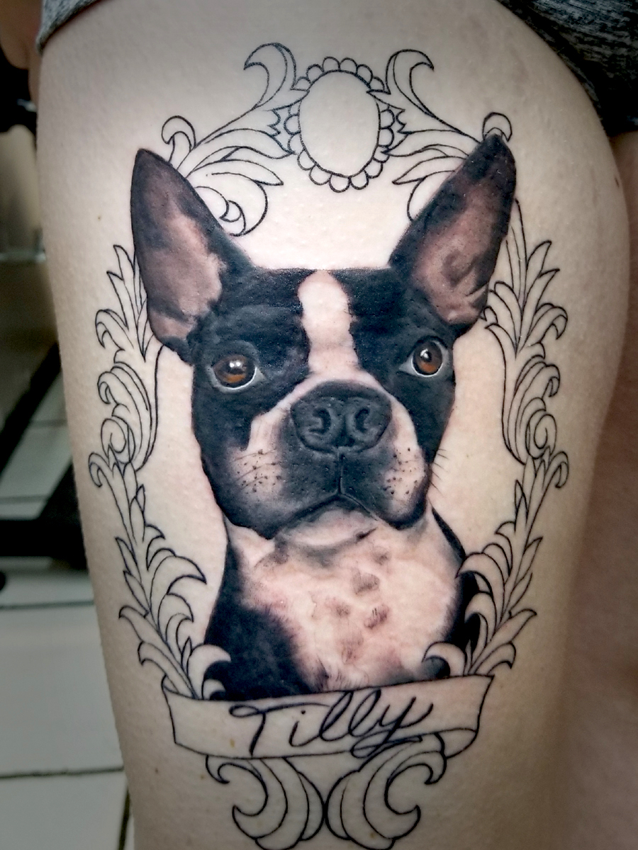 Leg tattoo of dog