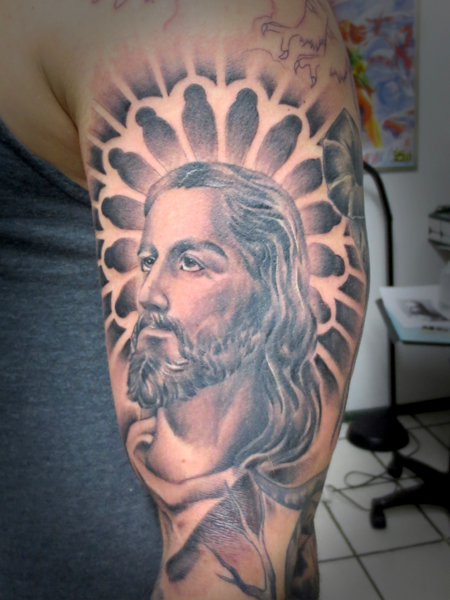 Arm tattoo of Jesus